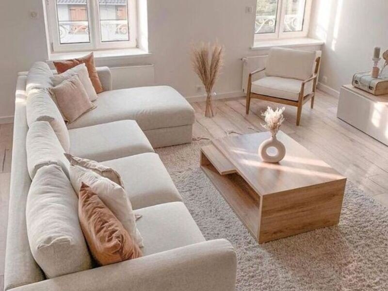 A compact living room with a sectional sofa and coffee table.